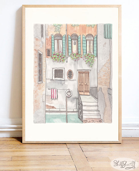 framed artwork of quaint Venice canal in Italy Europe showing a villa with green shutters, flowering plants and a beautiful patina, wall art decor by Shell Sherree
