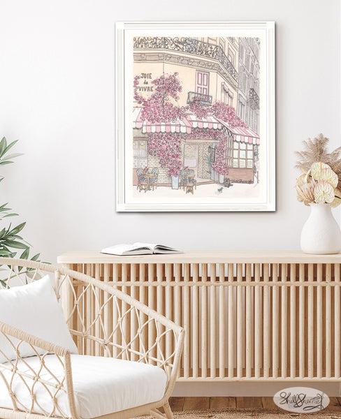 framed wall art print in lounge room of french cafe in paris with pink and white striped awnings, balconies, tables and chairs, black cat and bluebird and masses of pink flowers, original illustration by shell sherree