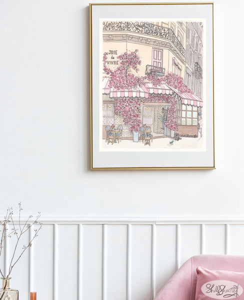 framed wall art print of french cafe in paris with pink and white striped awnings, balconies, tables and chairs, black cat and bluebird and masses of pink flowers, original illustration by shell sherree